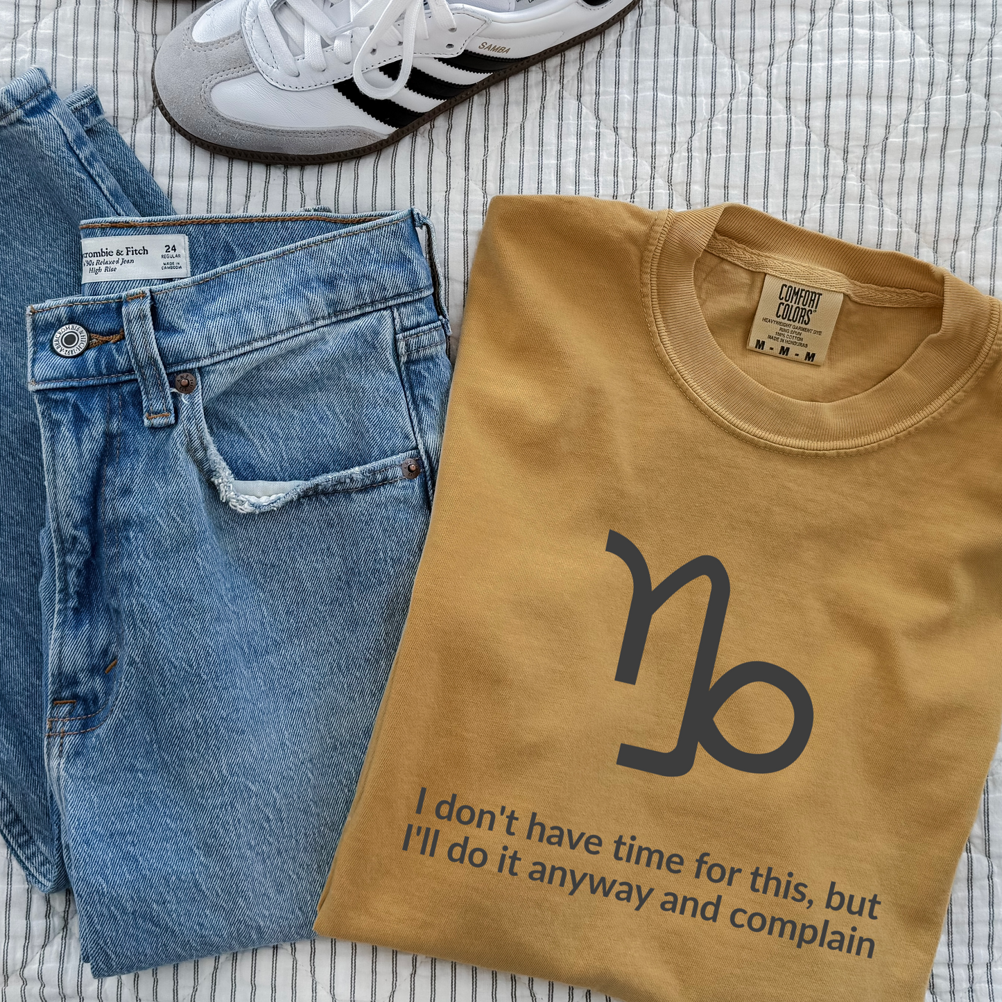 Capricorn zodiac t-shirt featuring “I Don’t Have Time for This, But I’ll Do It Anyway and Complain.” Funny astrology shirt for December and January birthdays. Earth sign graphic tee for ambitious, hardworking horoscope lovers. Trendy Horoscope clothing.