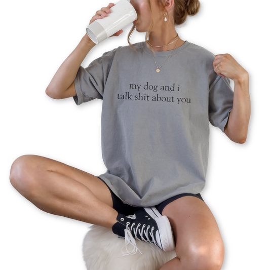 My Dog and I Talk Sh*t About You unisex vintage style graphic t-shirt for dog lovers. Funny dog lover quote printed on retro-inspired unisex t-shirt. Vintage style unisex tee featuring My Dog and I Talk Sh*t About You statement design.