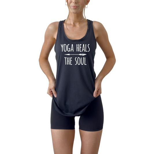 Women’s racerback tank top featuring “Yoga Heals the Soul” design, lightweight and breathable yoga shirt ideal for workouts, meditation, pilates, and daily fitness, soft activewear promoting mindfulness, balance, and wellness, flattering athletic fit perfect for studio or casual wear black tank top