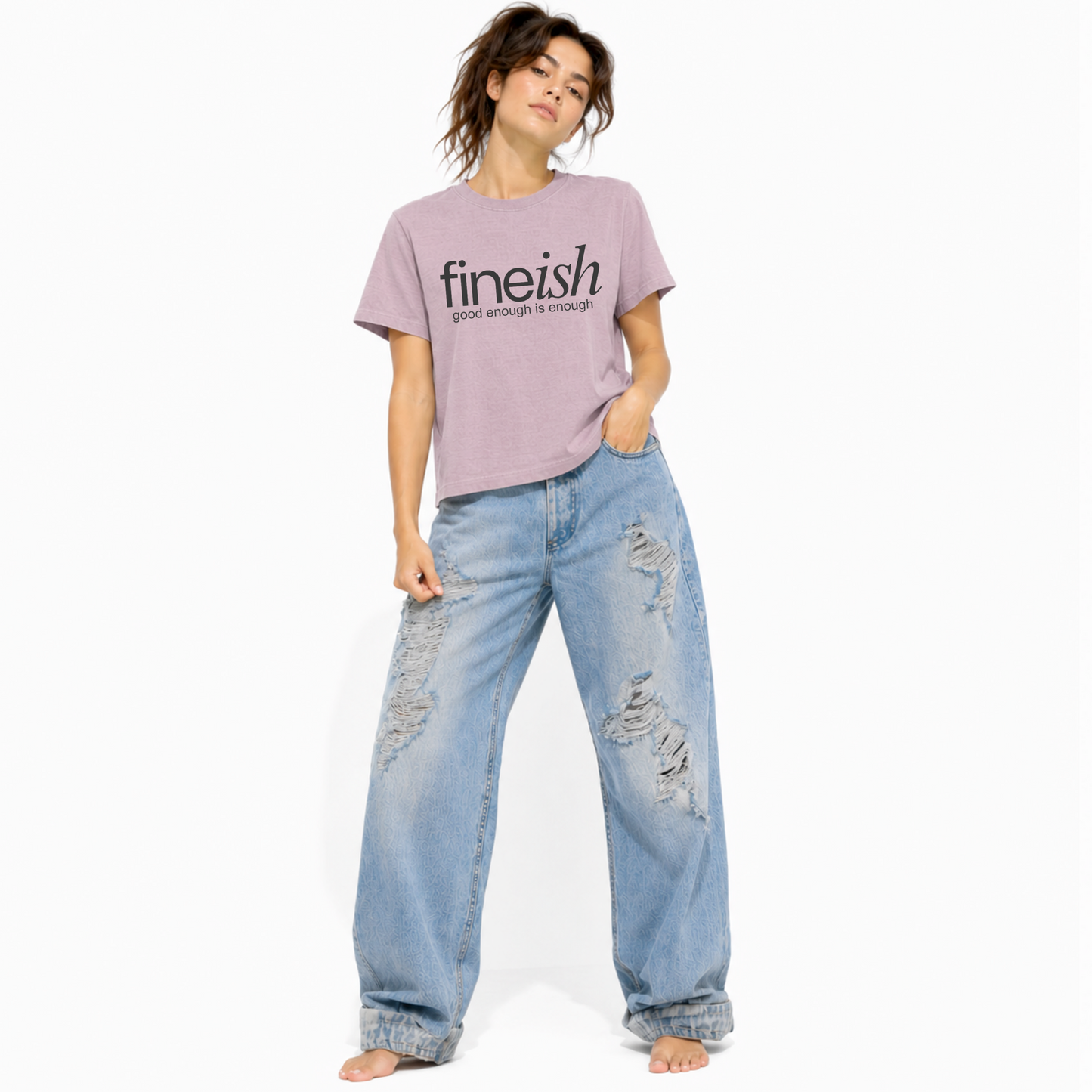 Model wearing a vintage lilac FINEish women's relaxed fit t-shirt with the "Good Enough Is Enough" design.