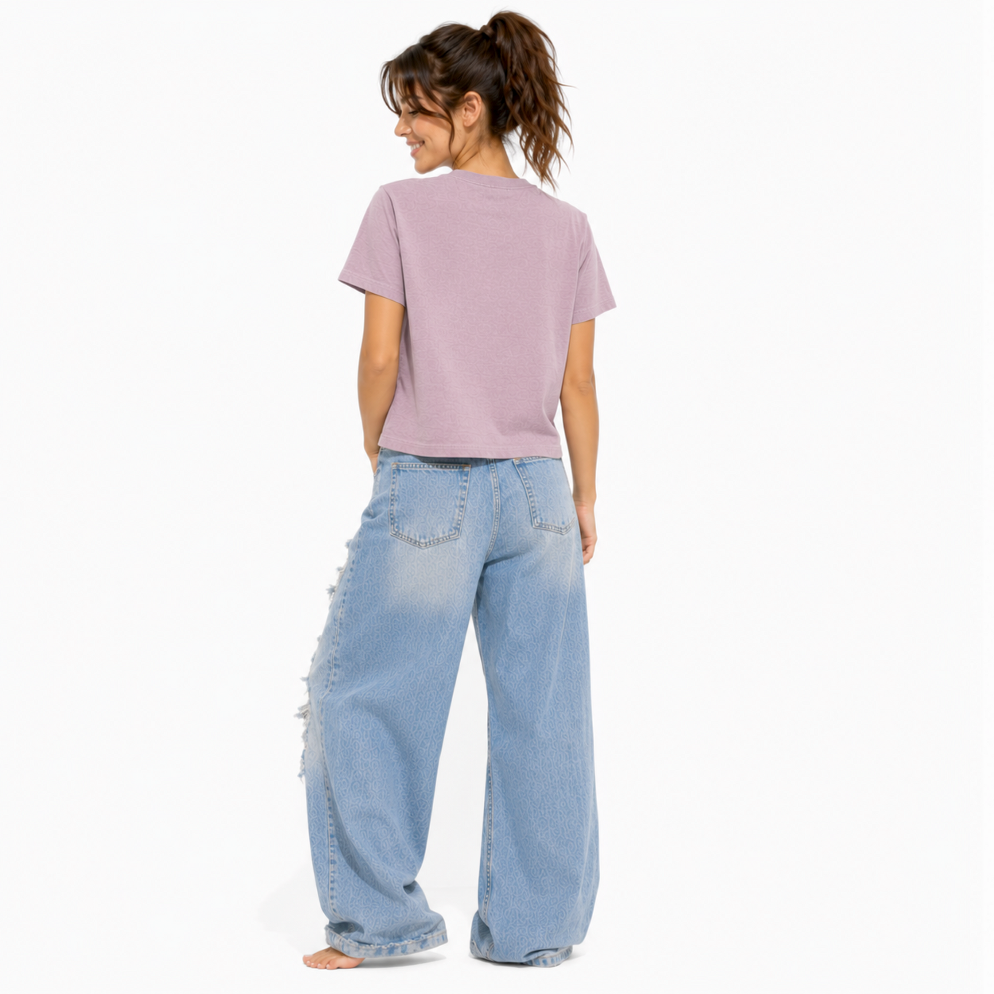 Back view of a vintage lilac women's relaxed fit t-shirt with a clean, plain back design.