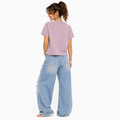 Back view of a vintage lilac women's relaxed fit t-shirt with a clean, plain back design.