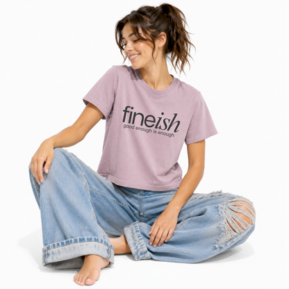 Vintage lilac women's relaxed fit t-shirt featuring the FINEish logo and "Good Enough Is Enough" graphic.