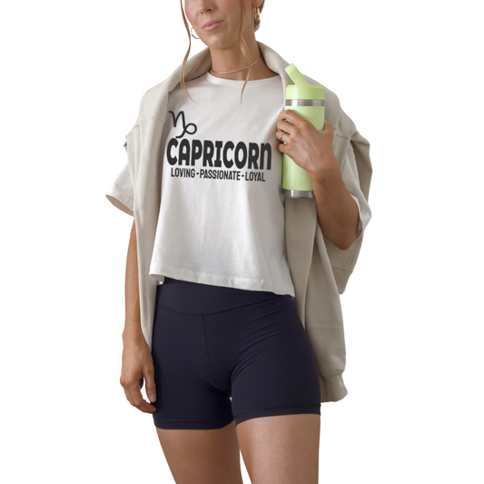 Capricorn zodiac horoscope t-shirt with “Loving. Passionate. Loyal.” Astrology graphic tee for December and January earth sign birthdays.