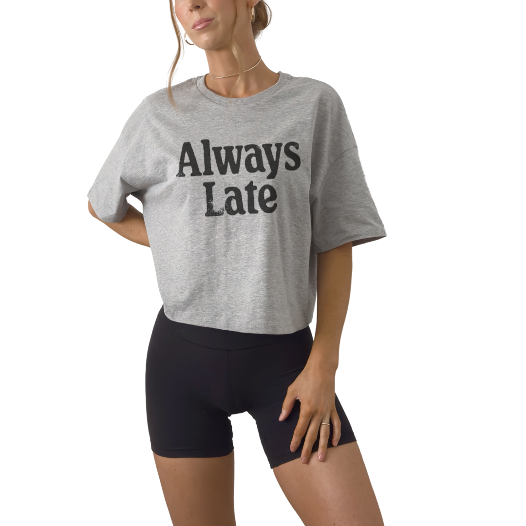 Women’s cropped graphic tee with Always Late quote. Funny fitted crop top and statement shirt for everyday wear.