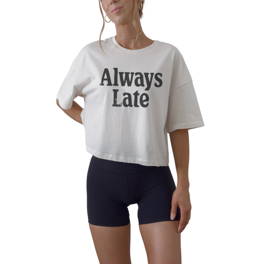 Women’s cropped graphic tee with Always Late quote. Funny fitted crop top and statement shirt for everyday wear.