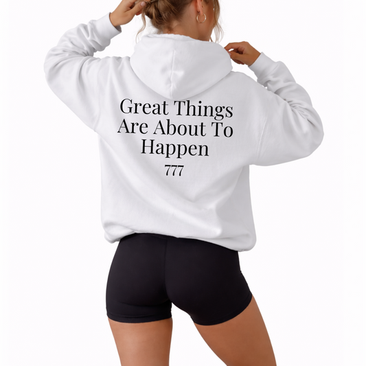 Unisex hoodie displaying angel number 777 on the front with “Great Things Are About to Happen” phrase, inspirational sweatshirt representing luck, alignment, spiritual awakening, and personal growth, soft pullover perfect for daily wear, uplifting numerology clothing with positive mindset message white hooded sweatshirt