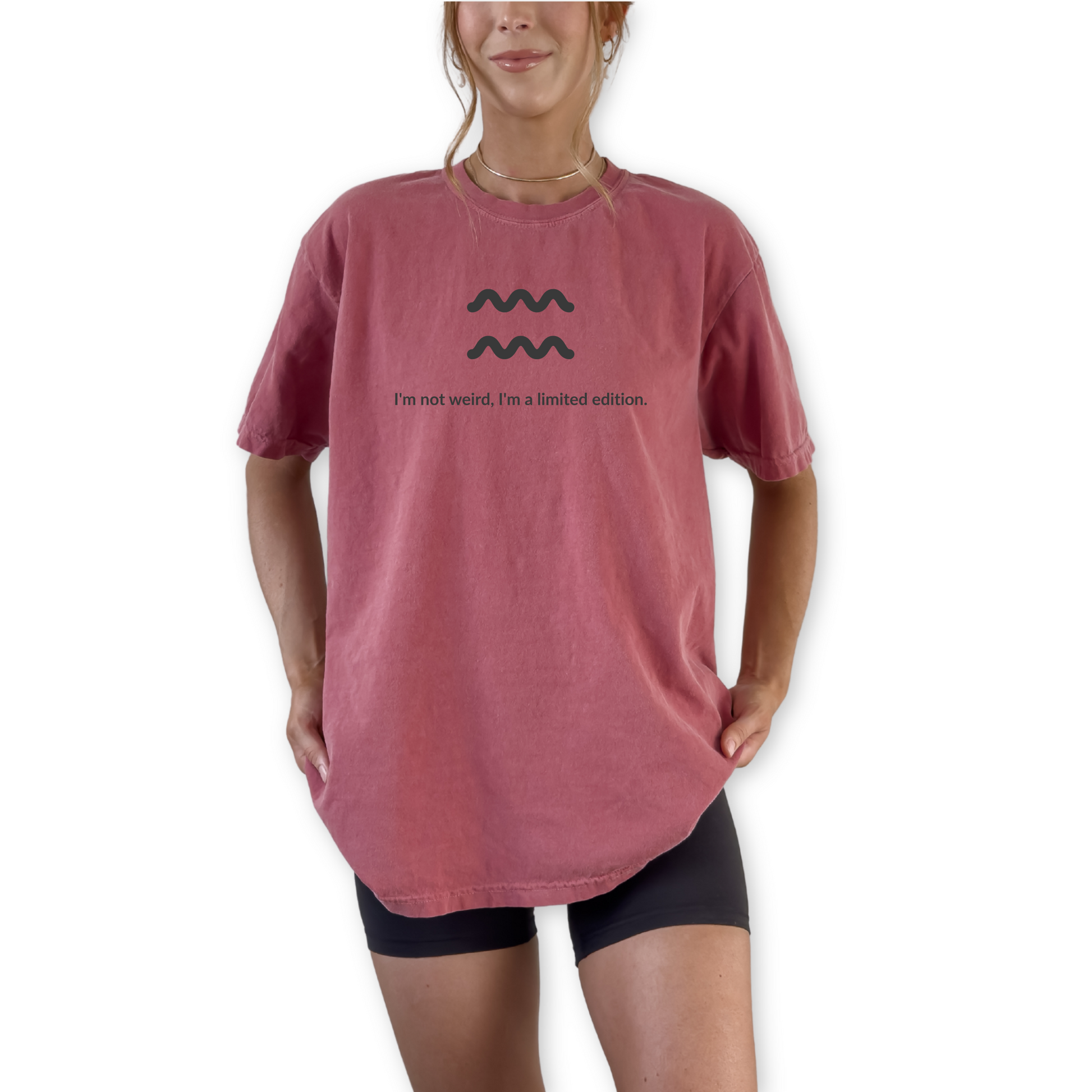 Aquarius zodiac graphic t-shirt featuring the quote "I'm not weird, I'm a limited edition." Astrology inspired unisex tee for Aquarius birthdays, horoscope lovers, and unique personality types.