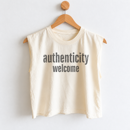 Women’s Authenticity Welcome muscle tank featuring a positive self-love message, heavyweight garment dyed cotton, mid length silhouette, relaxed boxy fit, and sleeveless design.
