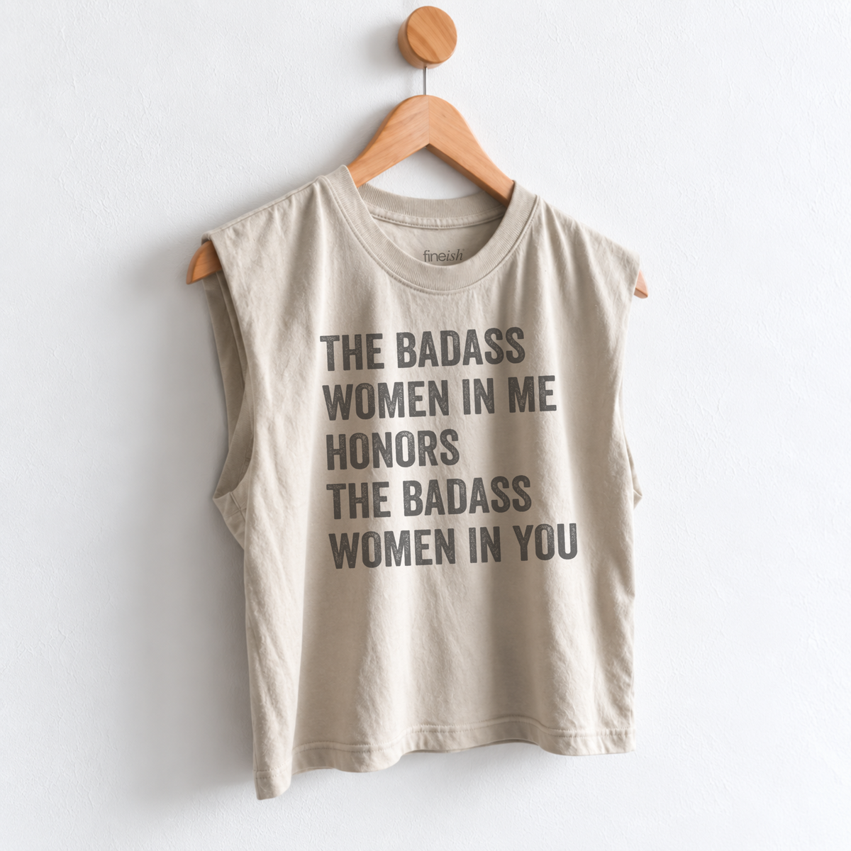 Women’s muscle tank featuring “The Badass Woman in Me Honors the Badass Woman in You,” an empowering graphic for strong women, friendship, confidence, and women supporting women. Fineish