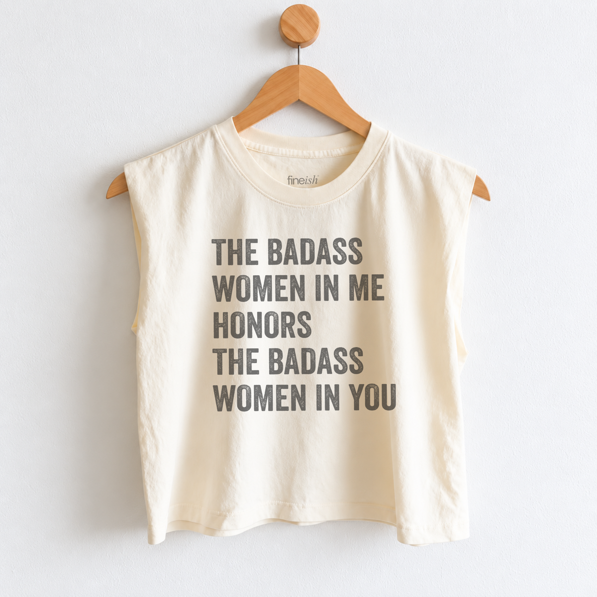 Women’s muscle tank featuring “The Badass Woman in Me Honors the Badass Woman in You,” an empowering graphic for strong women, friendship, confidence, and women supporting women. Fineish