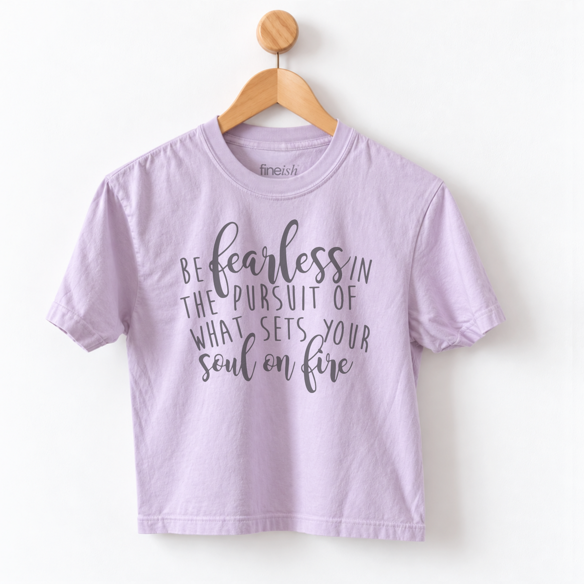 Women’s Be Fearless in the Pursuit of What Sets Your Soul on Fire graphic tee featuring an inspirational motivational message on a relaxed mid length garment dyed T-shirt.