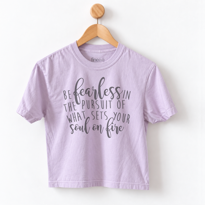 Women’s Be Fearless in the Pursuit of What Sets Your Soul on Fire graphic tee featuring an inspirational motivational message on a relaxed mid length garment dyed T-shirt.