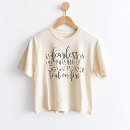 Women’s Be Fearless in the Pursuit of What Sets Your Soul on Fire graphic tee featuring an inspirational motivational message on a relaxed mid length garment dyed T-shirt.