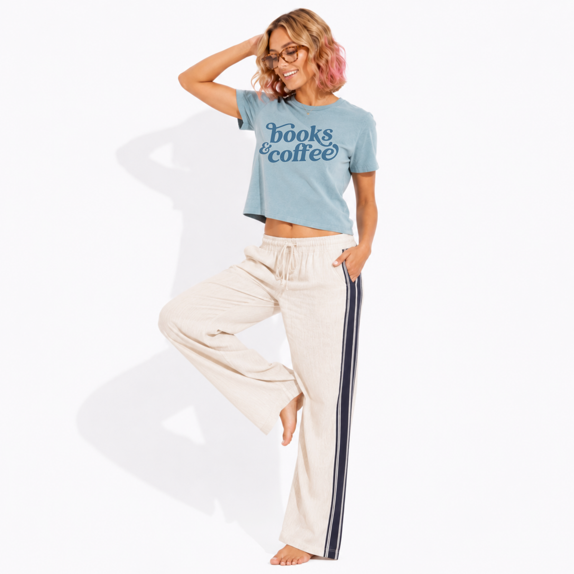 Women's vintage-style garment-dyed Books & Coffee t-shirt styled with a relaxed outfit, ideal for bookstore visits, cafés, and casual everyday wear.