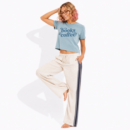 Women's vintage-style garment-dyed Books & Coffee t-shirt styled with a relaxed outfit, ideal for bookstore visits, cafés, and casual everyday wear.