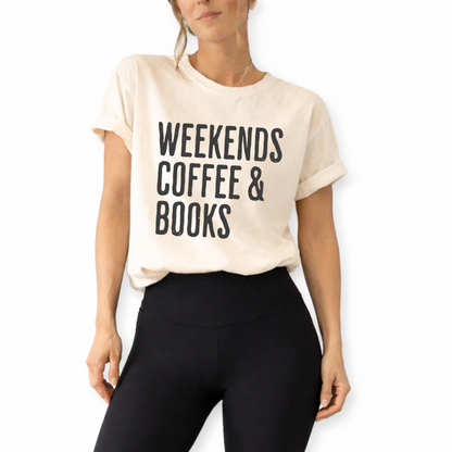 Book club graphic shirt paired with jeans and cardigan for autumn aesthetic and everyday casual look. Unisex retro Weekends Coffee and Books graphic t-shirt styled for cozy reader aesthetic outfit and casual café fashion.