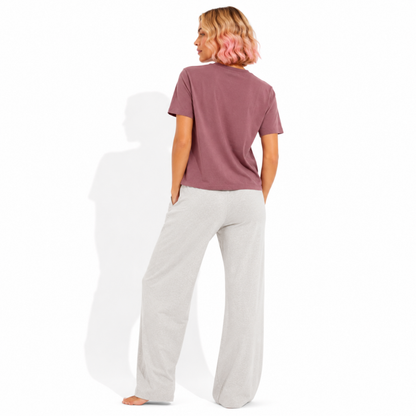 Back view of a women's washed garment-dyed t-shirt showing the relaxed fit and clean back while wearing the Cult Classic graphic tee for readers and book lovers.