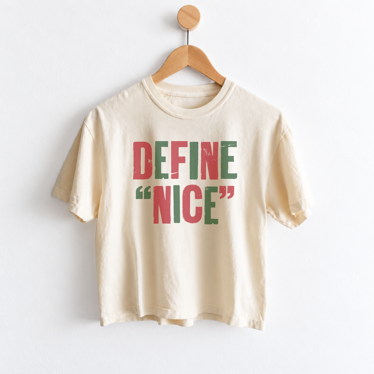 Women’s Define Nice Christmas graphic tee featuring a funny naughty or nice holiday saying, garment dyed fabric, mid length silhouette, relaxed fit, and crew neckline.