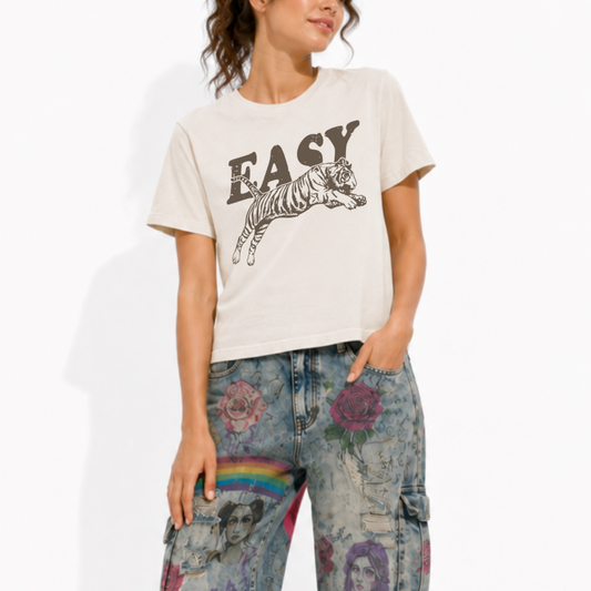 Woman wearing an Easy Tiger heavyweight mid-length graphic T-shirt featuring a vintage tiger illustration.