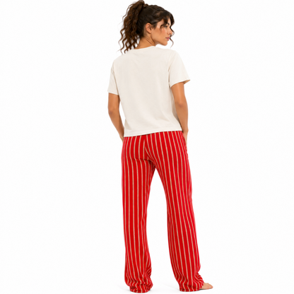 Back view of a vintage white women’s garment-dyed T-shirt showing the plain back and relaxed mid-waist fit.