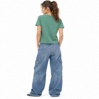 Back view of a women’s garment-dyed T-shirt in washed pine showing the plain back and mid-waist fit.