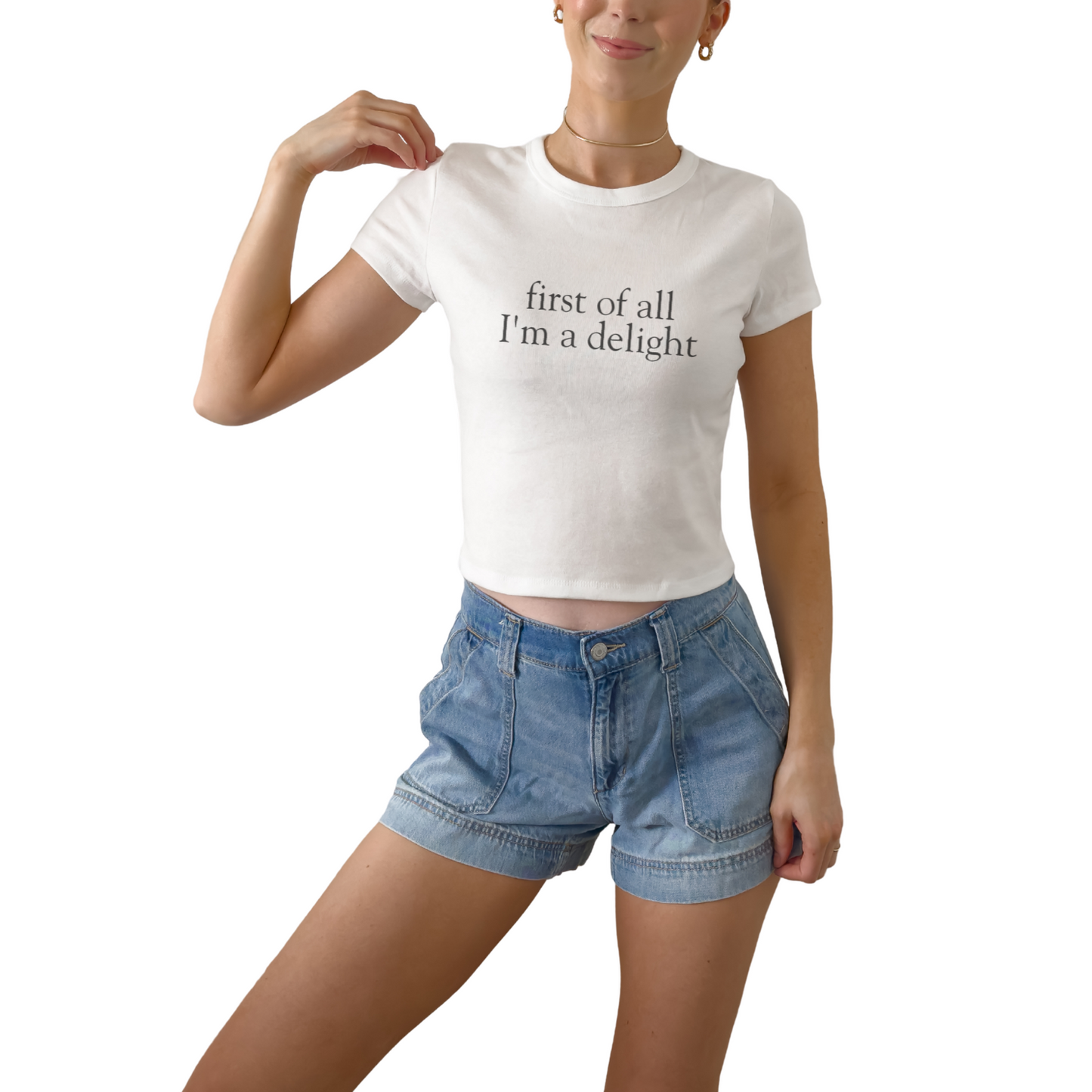 First of All I’m a Delight women’s baby tee featuring playful confident statement design. Women’s baby tee with First of All I’m a Delight quote. Trendy graphic top for everyday wear. First of All I’m a Delight statement printed on women’s baby tee graphic shirt.