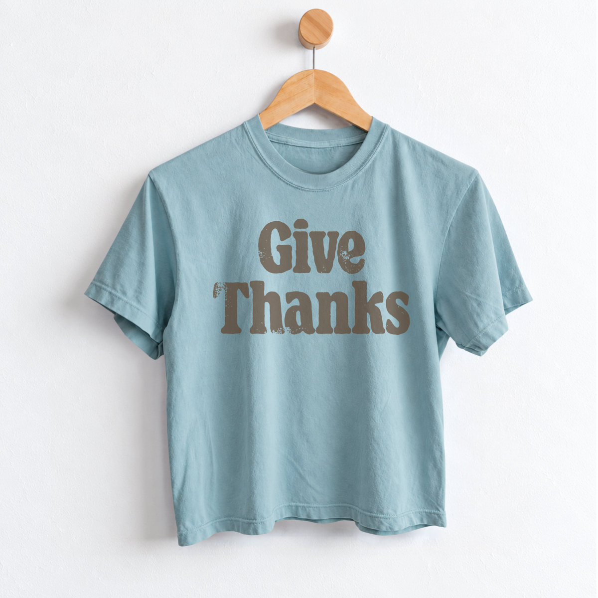 Women’s Give Thanks Thanksgiving graphic tee with garment dyed cotton fabric, mid length silhouette, relaxed fit, crew neckline, and festive fall holiday design.
