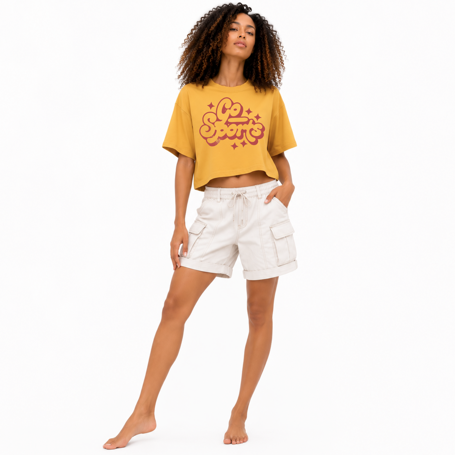 Model wearing a relaxed fit Go Sports cropped graphic tee styled for tailgating, football season, baseball games, and casual game day outfits.