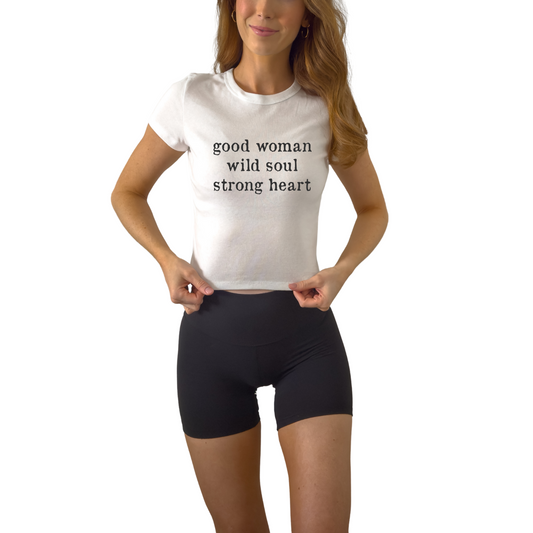 Good Women Wild Soul Strong Heart women’s baby tee featuring inspirational statement design. Fitted graphic t-shirt for confident, bold women.