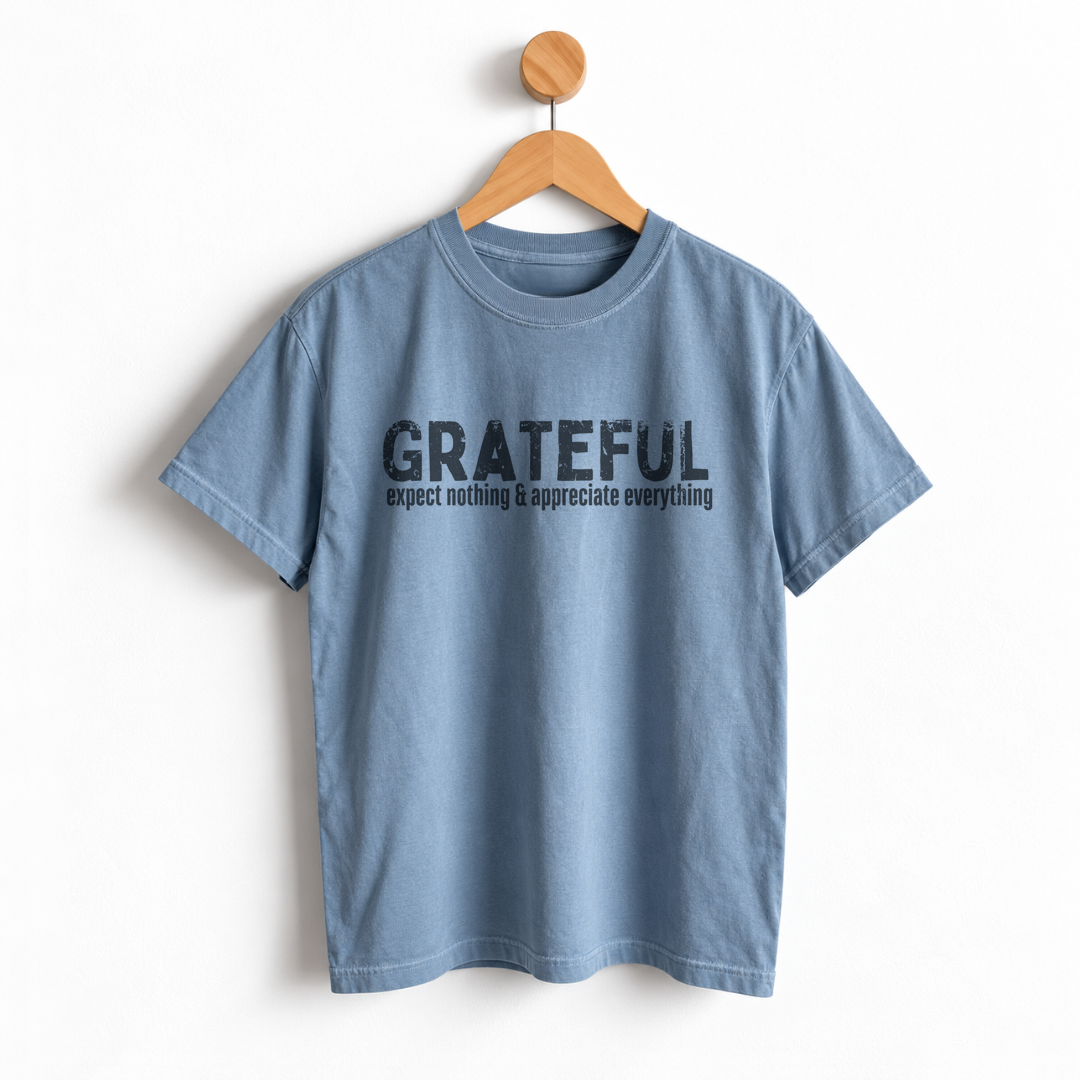 Women’s Thanksgiving boyfriend tee featuring “Grateful Expect Nothing & Appreciate Everything” graphic, garment dyed heavyweight cotton, relaxed unisex sizing, and a slightly oversized fit.