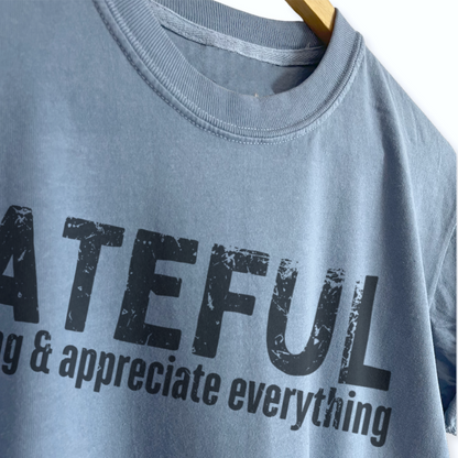 Women’s Thanksgiving boyfriend tee featuring “Grateful Expect Nothing & Appreciate Everything” graphic, garment dyed heavyweight cotton, relaxed unisex sizing, and a slightly oversized fit.