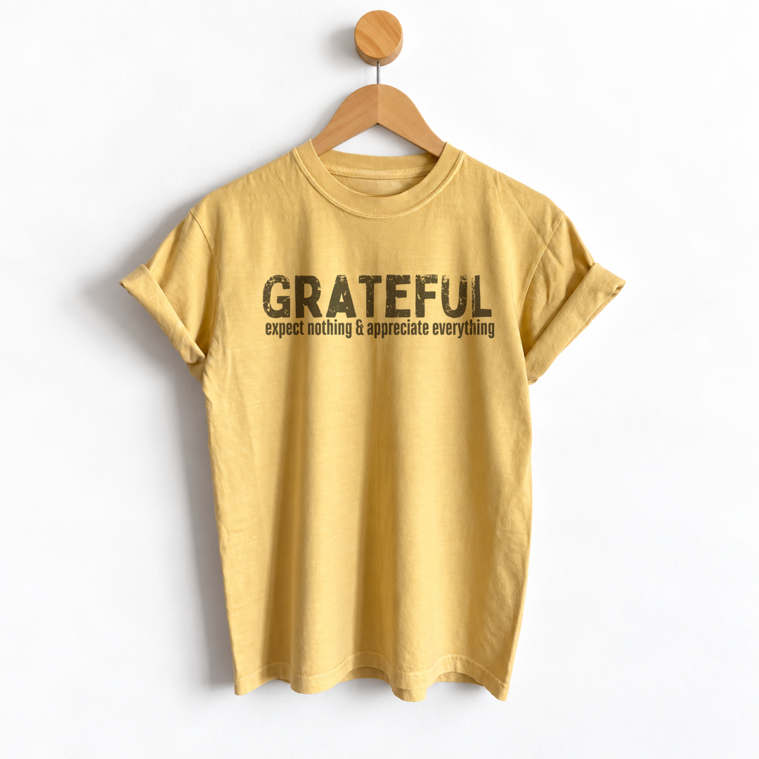 Women’s Thanksgiving boyfriend tee featuring “Grateful Expect Nothing & Appreciate Everything” graphic, garment dyed heavyweight cotton, relaxed unisex sizing, and a slightly oversized fit.