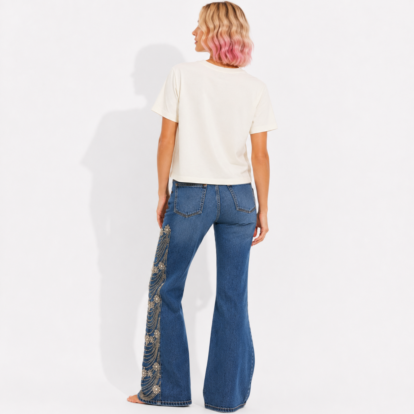 Back view of a women's mid-length garment-washed T-shirt showing the relaxed fit and plain back.