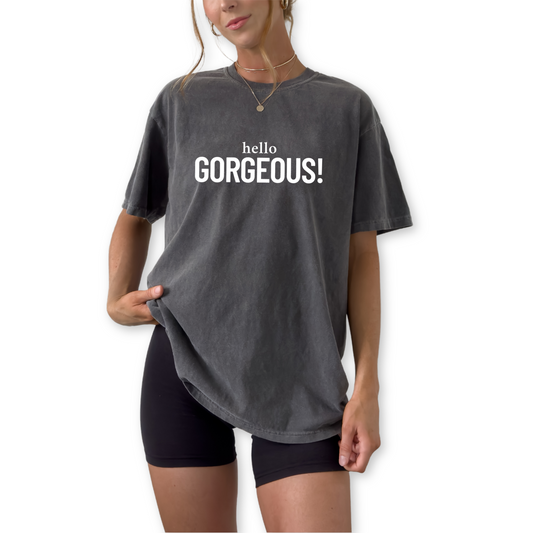 Hello Gorgeous unisex graphic t-shirt featuring bold statement design. Cute confidence shirt and gift for her, perfect for everyday wear.