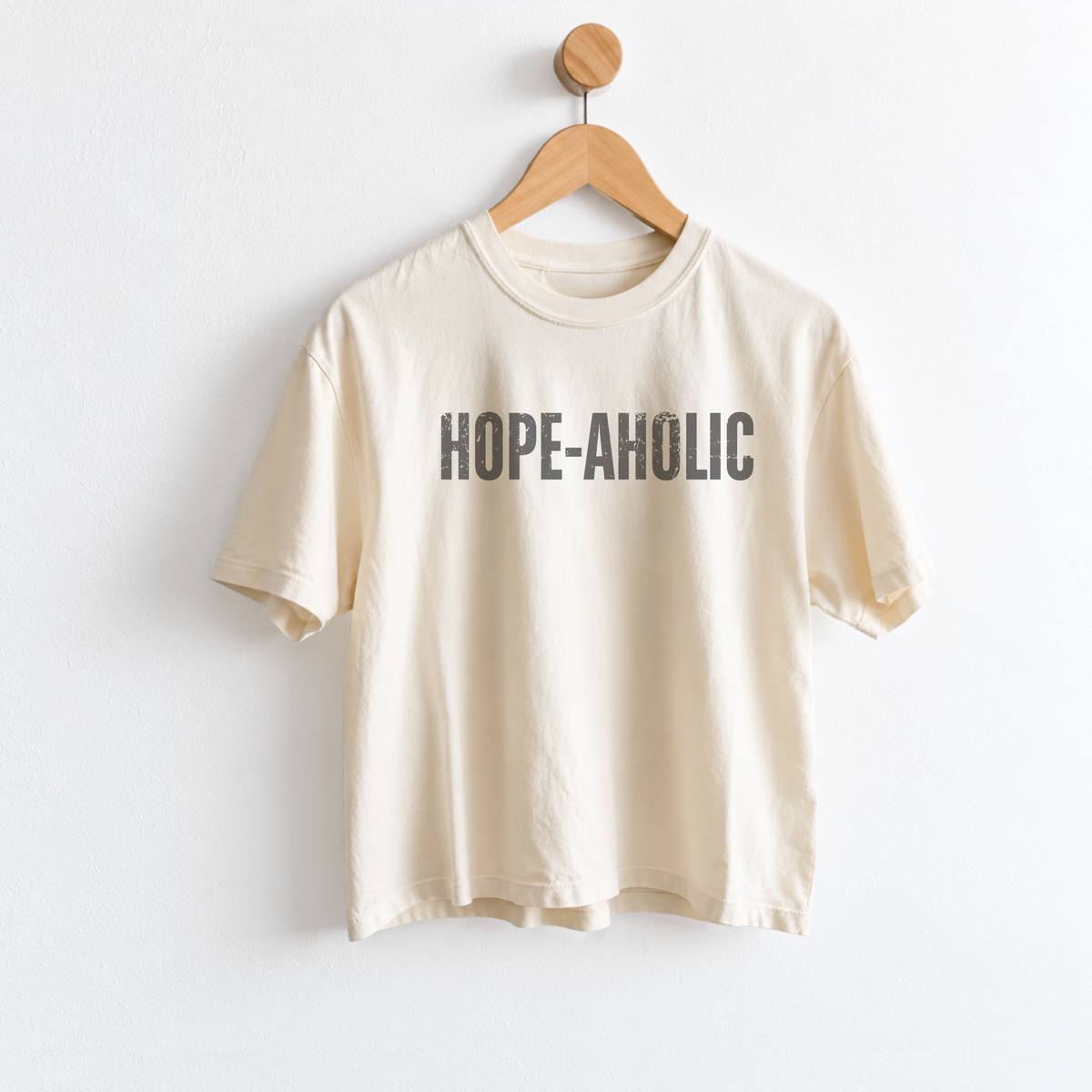 Women’s Hope-aholic graphic tee featuring a playful uplifting message about choosing hope and optimism, with a relaxed mid length fit for easy everyday style. Shop Fineish Tees