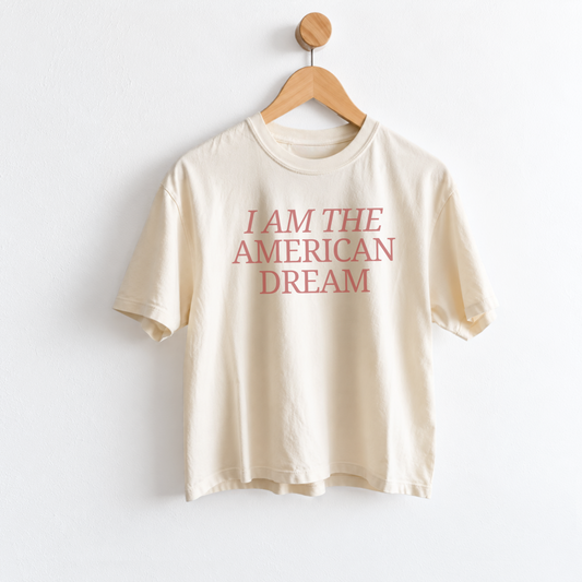 Women’s I Am the American Dream graphic tee featuring a patriotic American saying on a garment dyed mid length T-shirt, perfect for USA style and everyday Americana outfits. Shop Fineish