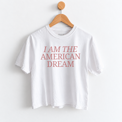 Women’s I Am the American Dream graphic tee featuring a patriotic American saying on a garment dyed mid length T-shirt, perfect for USA style and everyday Americana outfits. Shop Fineish