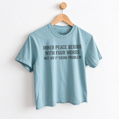Women’s Inner Peace Begins With 4 Words Not My F*cking Problem graphic tee featuring a funny sarcastic self-care saying for women with a sense of humor. fineish women tee
