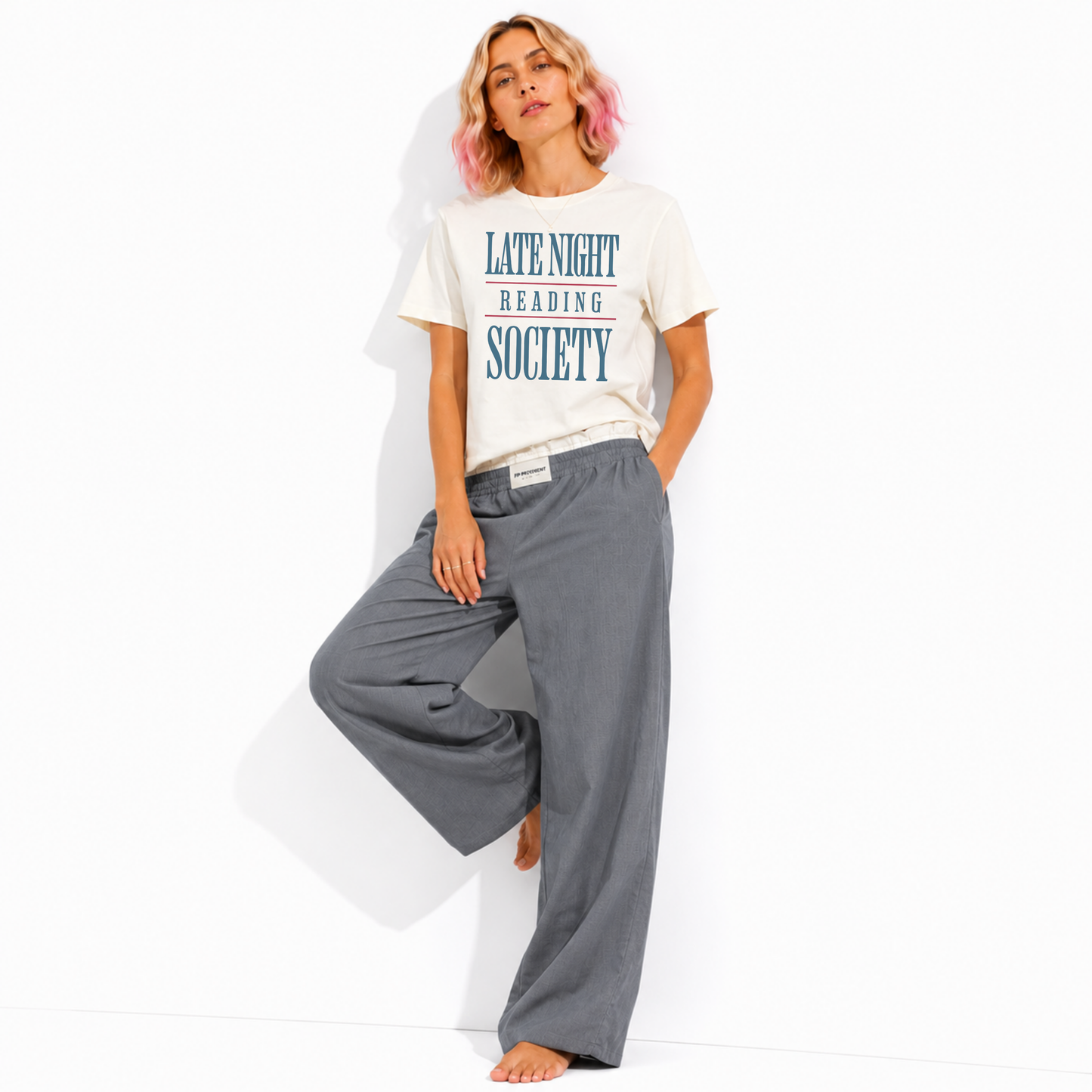 Women's vintage garment-dyed Late Night Reading Society t-shirt styled for a cozy bookstore, library, or coffee shop with a relaxed casual look.