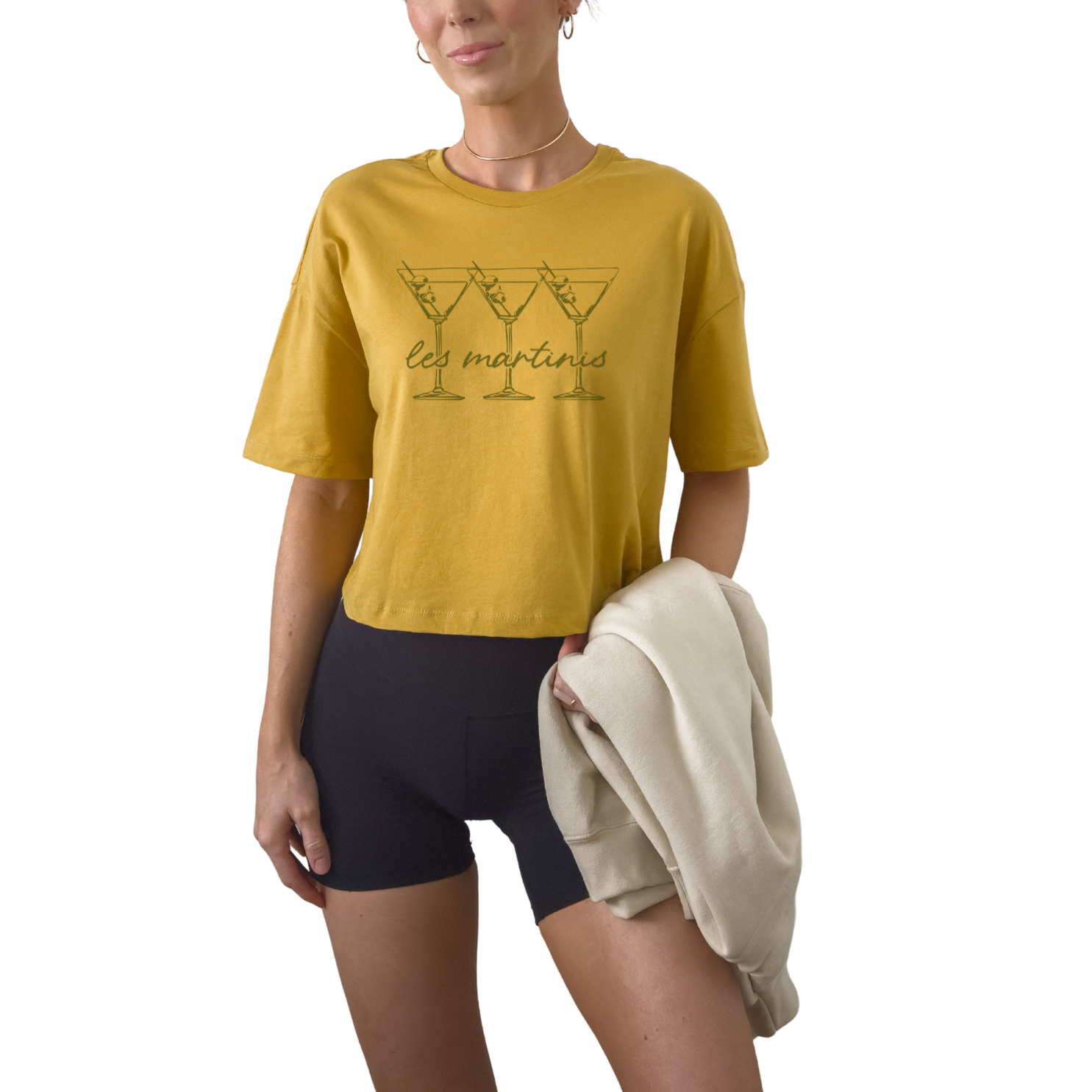 Women’s Les Martinis cropped graphic t-shirt styled for European summer and cocktail bar outfit. French inspired martini slogan crop top in off white mustard and athletic gray. Trendy girls trip outfit shirt perfect for bachelorette weekend and rooftop drinks