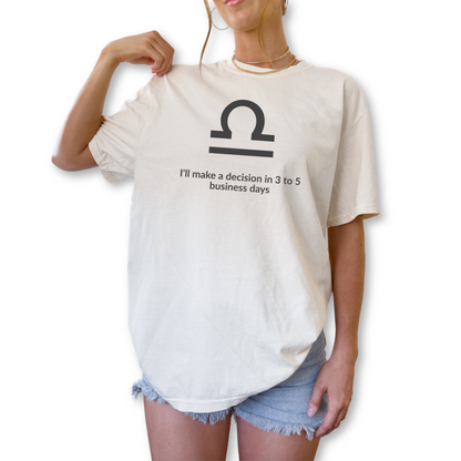 Libra zodiac t-shirt featuring “I’ll Make a Decision in 3 to 5 Business Days.” Funny astrology shirt for September and October birthdays. Air sign graphic tee for horoscope lovers who embrace indecisive personality traits.