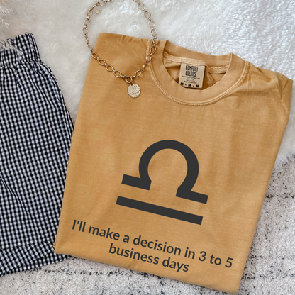 Libra zodiac t-shirt featuring “I’ll Make a Decision in 3 to 5 Business Days.” Funny astrology shirt for September and October birthdays. Air sign graphic tee for horoscope lovers who embrace indecisive personality traits.