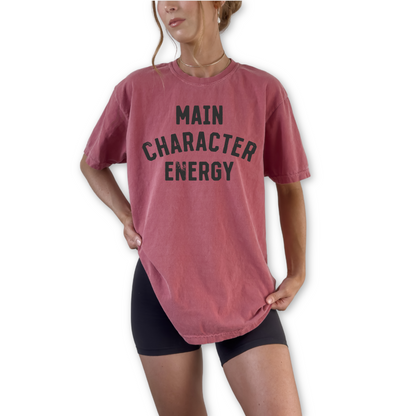 Unisex retro Main Character Energy graphic t-shirt styled for trendy streetwear and confident everyday outfit. Minimalist trendy outfit shirt paired with denim and sneakers for cool casual street style