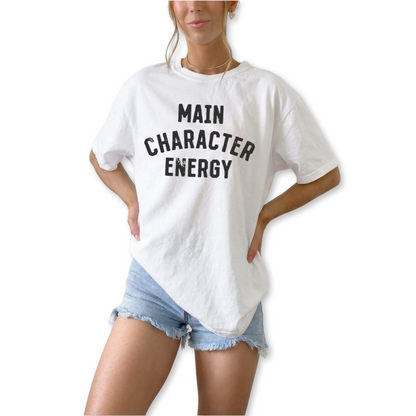 Unisex retro Main Character Energy graphic t-shirt styled for trendy streetwear and confident everyday outfit. Minimalist trendy outfit shirt paired with denim and sneakers for cool casual street style