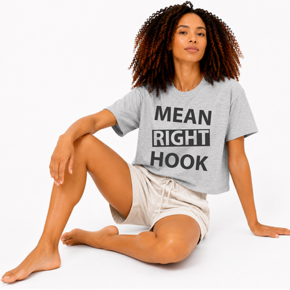 Close-up of the “Mean Right Hook” graphic printed on an athletic heather grey women’s boxy crop T-shirt.