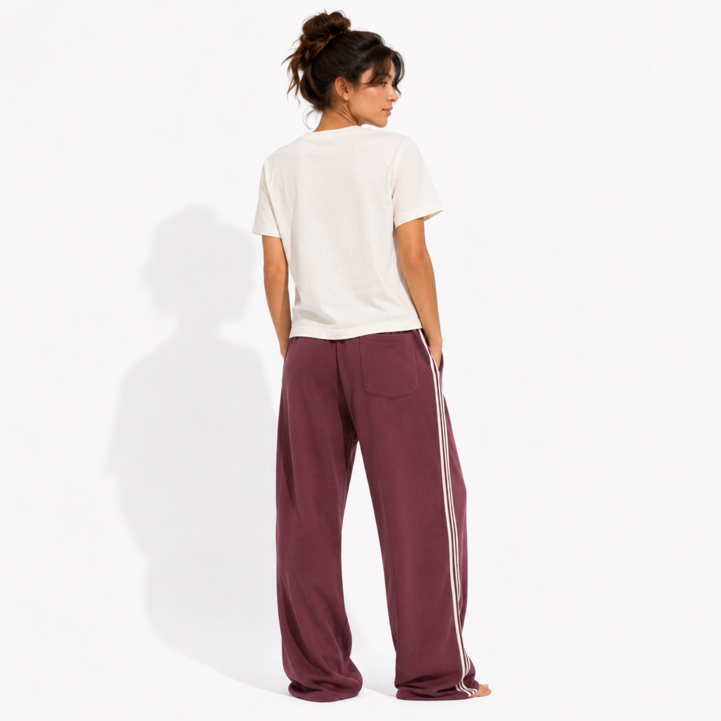 Back view of a women's washed garment-dyed t-shirt showing the relaxed fit and clean back while wearing the "Member of the Girl Book Club" graphic tee.