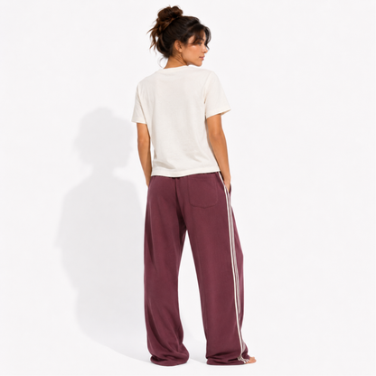 Back view of a women's washed garment-dyed t-shirt showing the relaxed fit and clean back while wearing the "Member of the Girl Book Club" graphic tee.