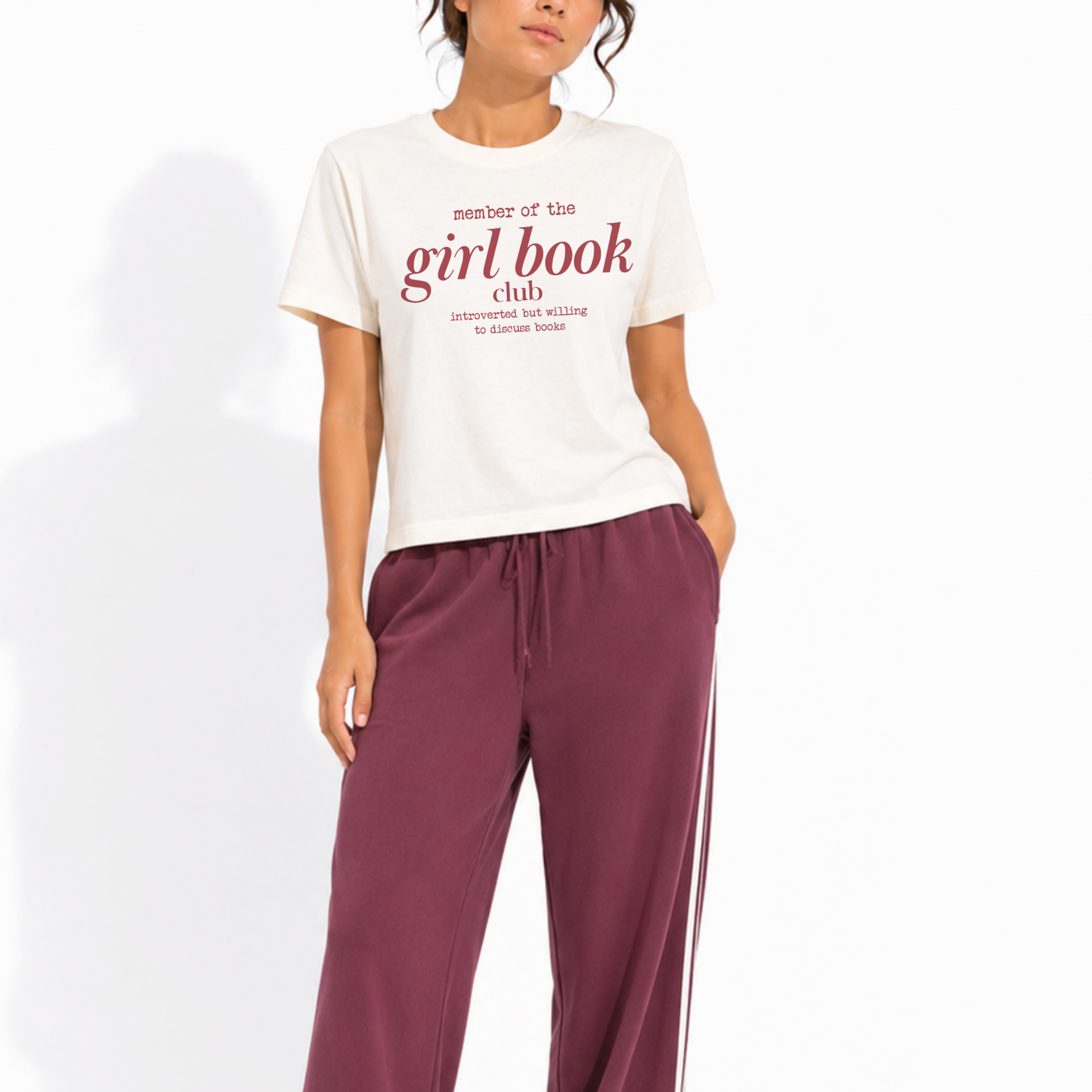 Woman wearing a washed garment-dyed t-shirt with the design "Member of the Girl Book Club – Introverted but Willing to Discuss Books," perfect for book lovers and readers.