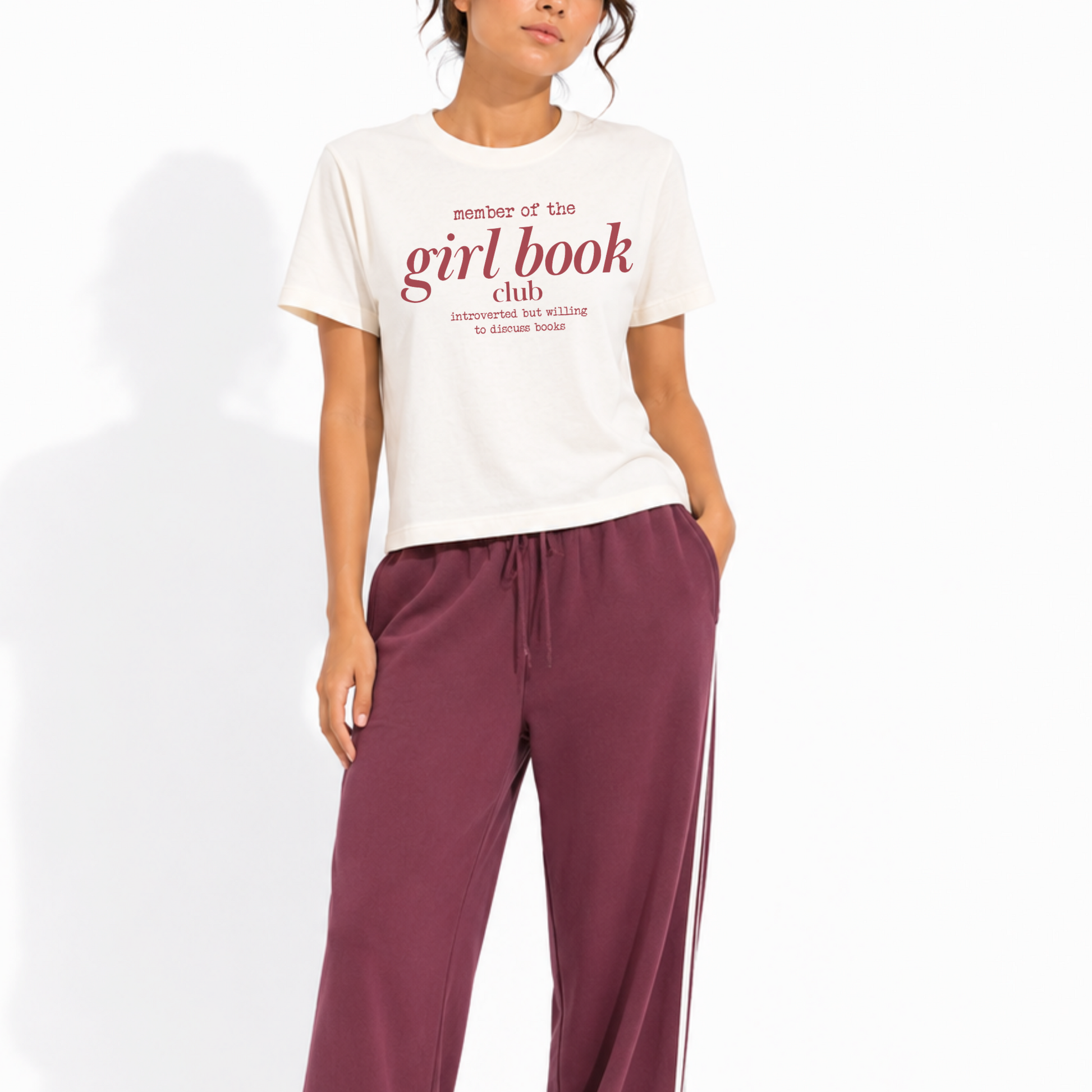 Woman wearing a washed garment-dyed t-shirt with the design "Member of the Girl Book Club – Introverted but Willing to Discuss Books," perfect for book lovers and readers.